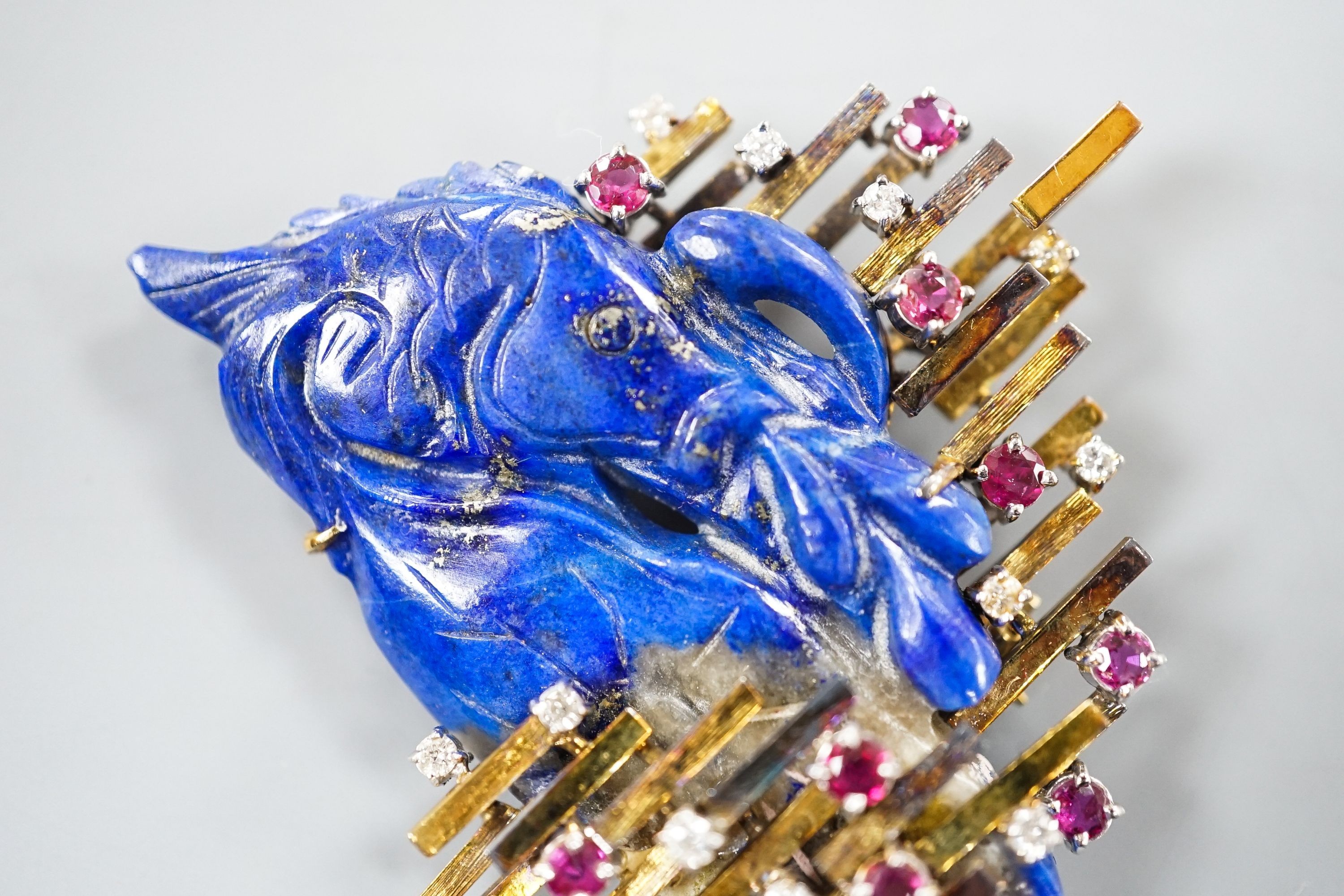 A 585 yellow metal, ruby, diamond and apis lazuli set modernist brooch, maker's mark KK, width 52mm, gross weight 21.4 grams